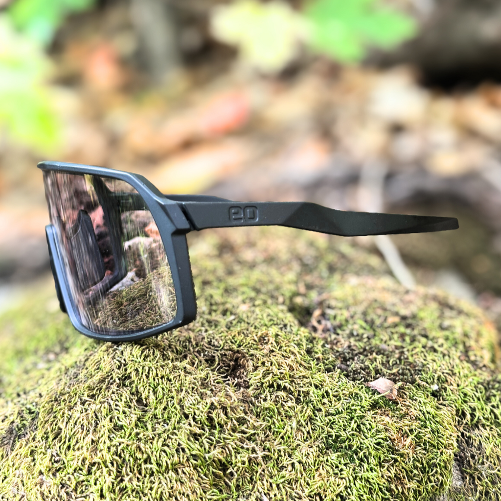 Eastern Outer Kamas photochromic mountain bike sunglasses with moss-colored frame and lenses, shown in profile view.