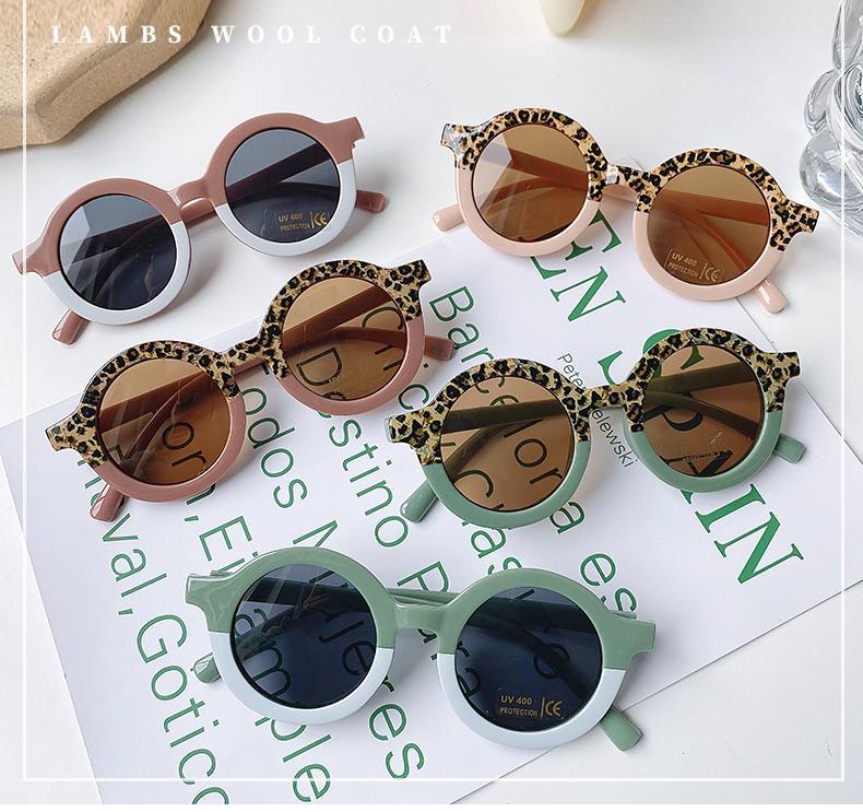 Stevvex children's sunglasses with playful leopard and bear designs, round shape, suitable for boys and girls.