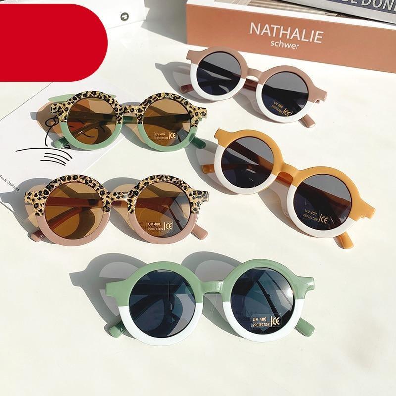 Stevvex children's sunglasses featuring leopard and cartoon bear shapes, round design for boys and girls, stylish and protective eyewear.