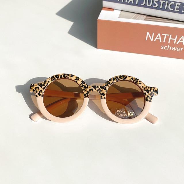 Stevvex children's sunglasses with playful leopard and bear shapes, round design, suitable for boys and girls.