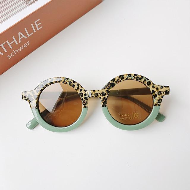 Stevvex children's sunglasses featuring leopard and bear shapes, round style, colorful frames for boys and girls.