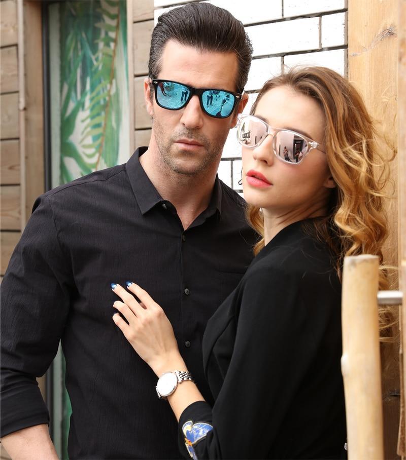 Stylish polarized colorful sunglasses from Stevvex with reflective lenses and transparent frame, suitable for men and women.