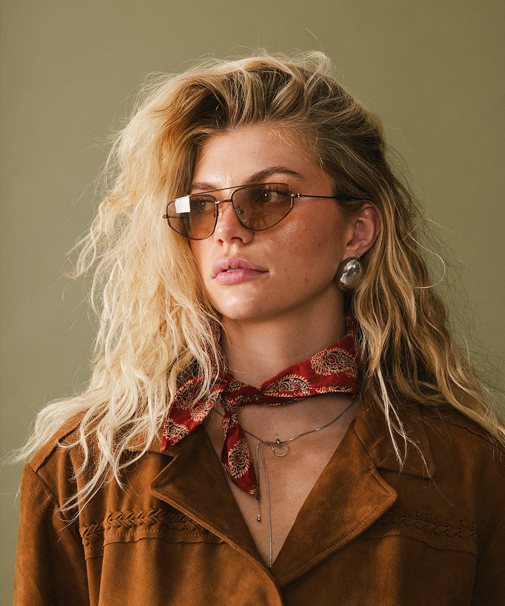 Brown Sienna aviator sunglasses by GIGI PIP with metal frames and tinted lenses, styled for a classic, trendy look.