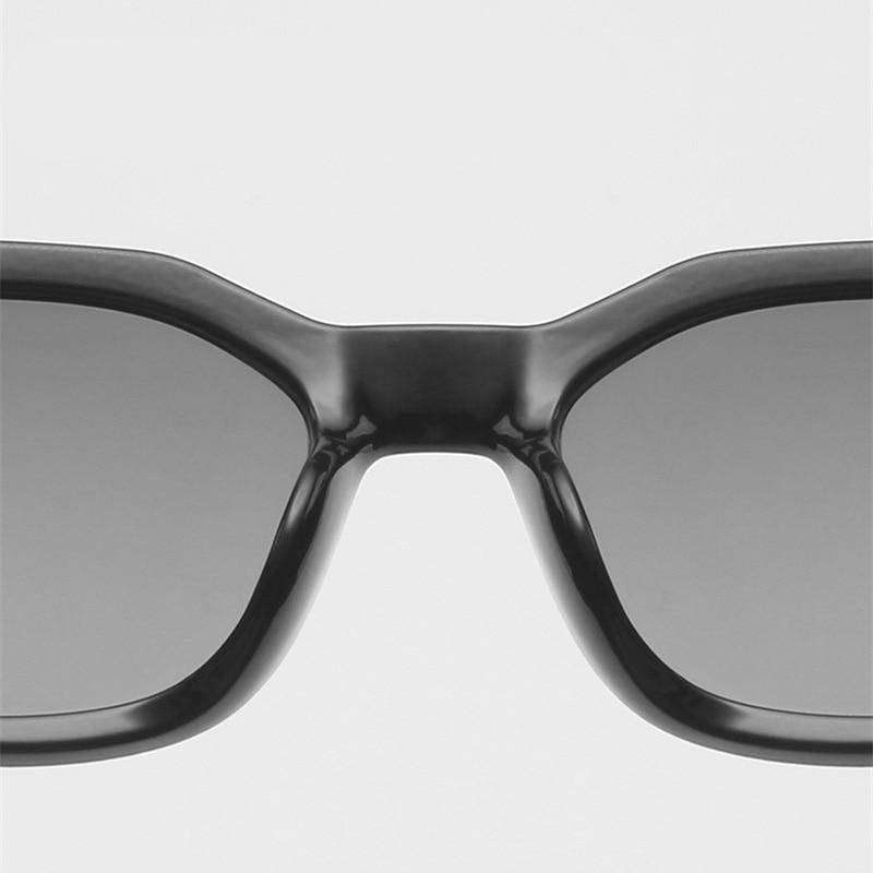Stevvex retro sunglasses for women and men with oversized square frames and dark lenses, fashion-forward designer eyewear.