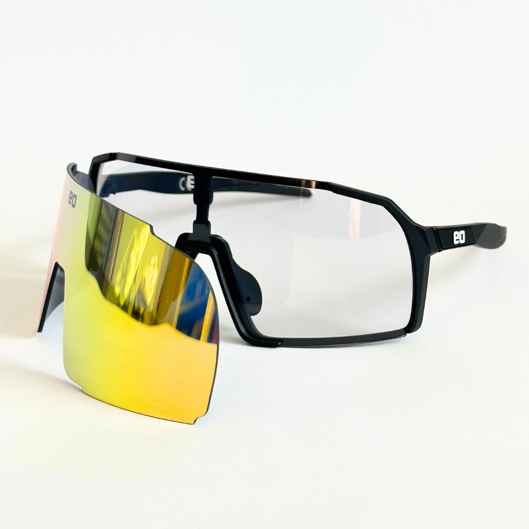 Eastern Outer Uno Mas Photochromic+ small youth sunglasses with black frames and gold accents, featuring photochromic lenses.