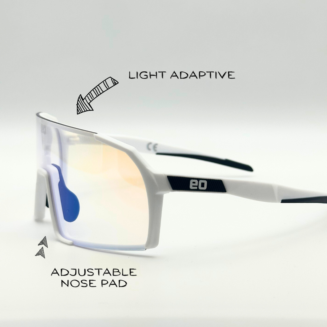Youth white sunglasses with clear photochromic lenses from Eastern Outer, featuring a stylish small frame and angled design.